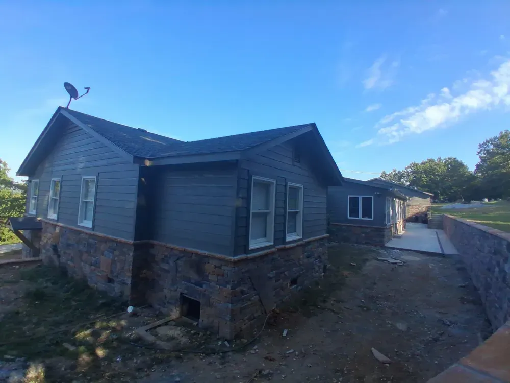 New house with foundation skirting clad in Walnut Ridge stone