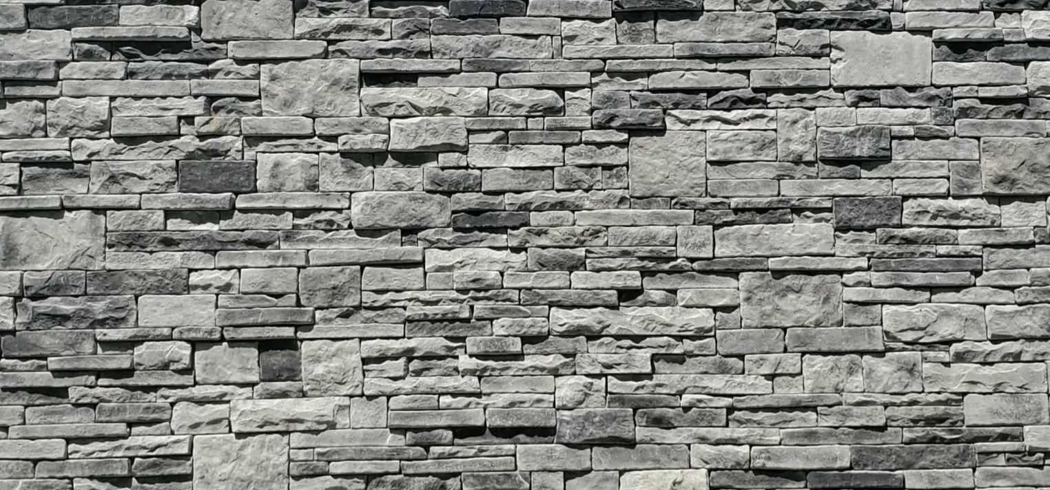Close-up of gray stacked stone in light and dark gray tones