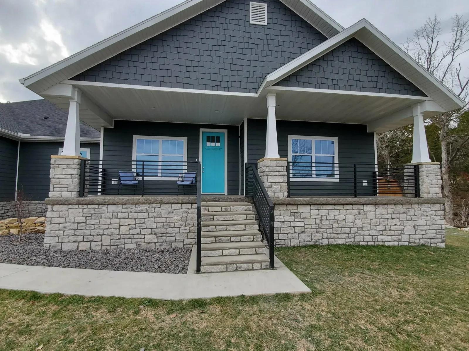 House front with limestone porch wall, steps and column bases