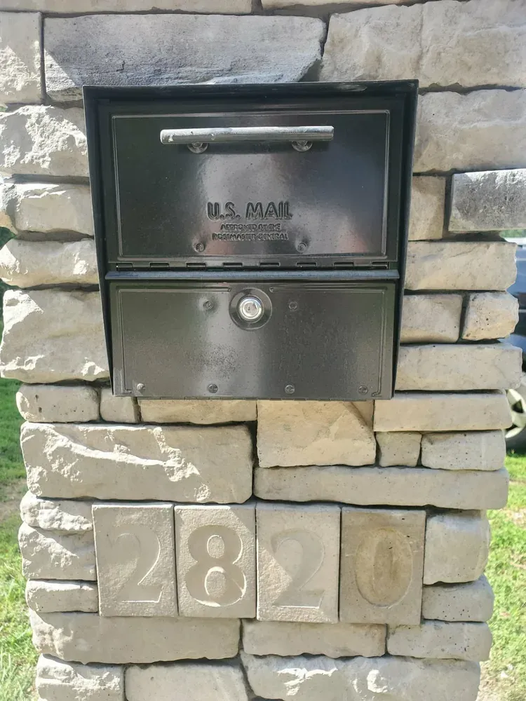 Stone mailbox pillar with cast stone address numbers 2820