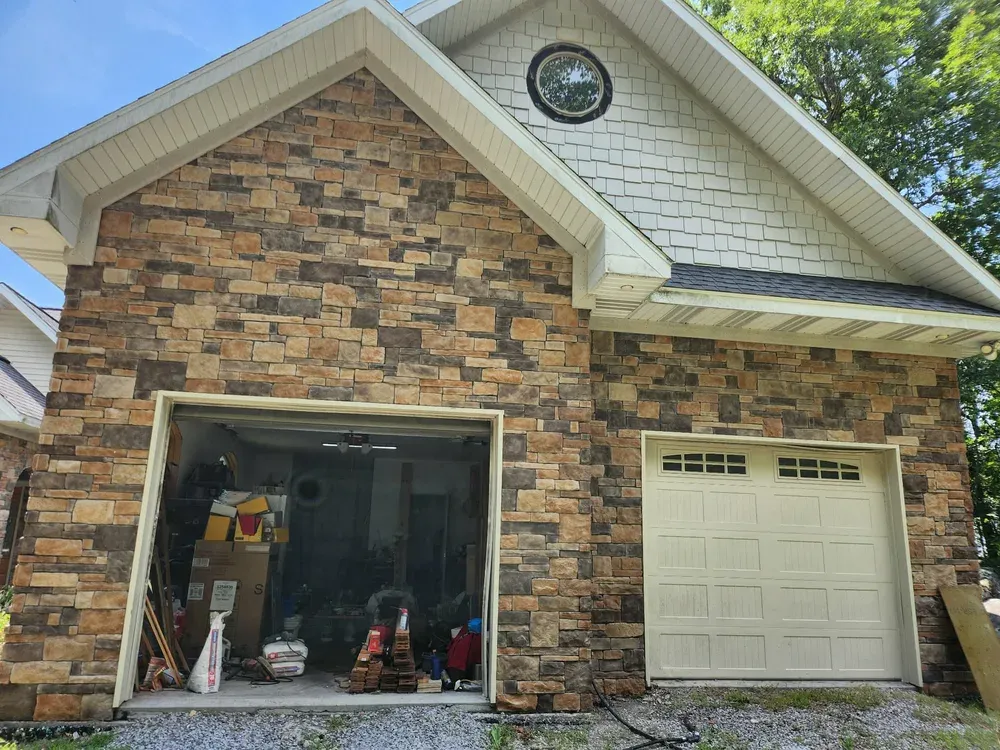 Garage front clad in mixed dry stack stone