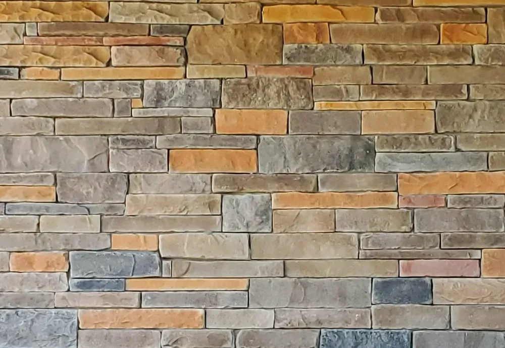 Close-up of mixed gray and tan ledge stone showing the color range